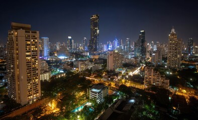 Obraz premium Cityscape at night, tall buildings, lights, trees