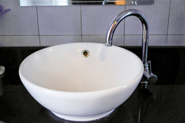 Modern White Ceramic Vessel Sink with Chrome Faucet in Vacation Room