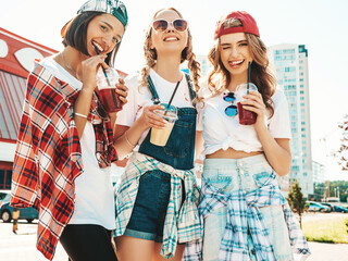 Three young beautiful smiling hipster female in trendy summer clothes.Sexy carefree women posing...