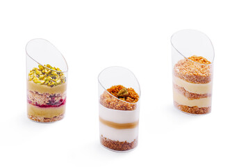 Exquisite layered desserts served in elegant transparent cups at a pastry shop