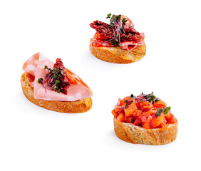 Delicious bruschetta with assorted toppings on a white background