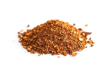 A small mound of authentic taco seasoning blend, featuring visible flecks of chili, paprika, and cumin, set against a bright white backdrop