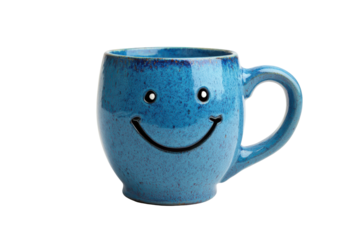 Blue ceramic mug with a happy smiley face isolated on transparent background. Cheerful blue mug with smiling face design isolated on white background.