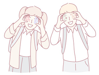 Two cheerful children are playfully making silly faces at each other, showcasing the joy and bond of friendship