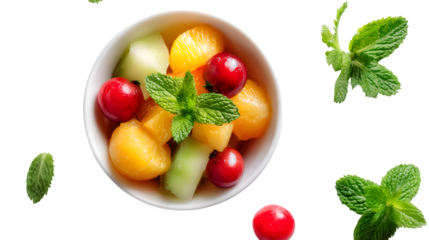 bowl of fresh fruit with mint leaves, health and balance theme, white background