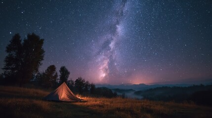 Stargazing from a sleeping bag beside a tent 