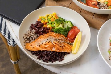 Nutritious salmon quinoa bowl with vegetables
