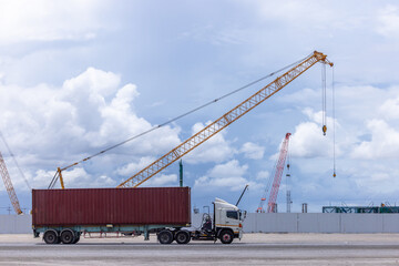Construction site with construction crawler cranes and multi storey unfinished buildings, Many high rise cranes and industrial construction equipment, Contruction site blue sky background.