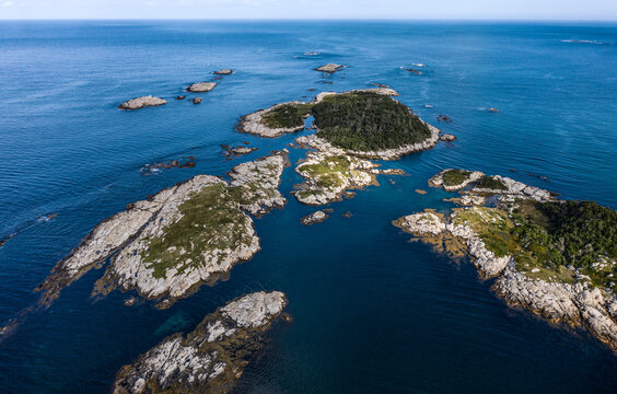 Aerial view of rocky islands in Canso Nova scotia set on blue water