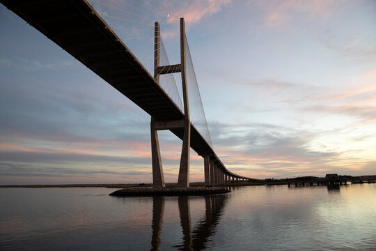 A reflection of Sidney Lanier bridge at sunset
