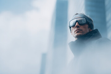 person wearing headphones stands against backdrop of modern city architecture immersed in futuristic experience