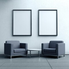 Two framed canvases on a light-gray wall, dark-gray armchairs, and a small table