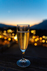 Champagne Toast at Sunset with City Lights in Bokeh
