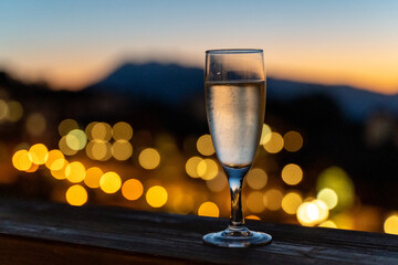 Champagne Toast at Sunset with City Lights in Bokeh