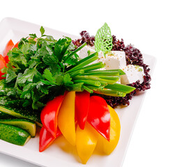 Fresh vegetable platter featuring herbs and cheese prepared for a healthy meal