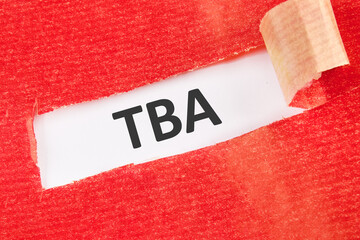TBA the inscription under the torn paper on a white background