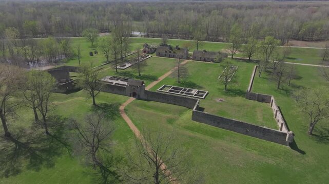 Aerial view of the old stone ruins of Fort de Chartres, standing in bright contrast to the lush green grass and surrounding trees, Prairie du Rocher, Illinois, United States.