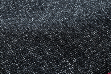 Black fabric with woven white threads and large dense weave for backgrounds, fabric