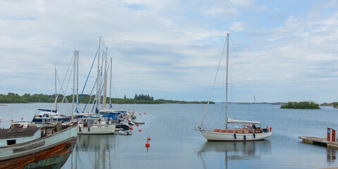 Sailboat harbor, many beautiful moored sail yachts in the sea port, modern water transport, summertime vacation, luxury lifestyle and wealth concept, Finland, Baltic Sea