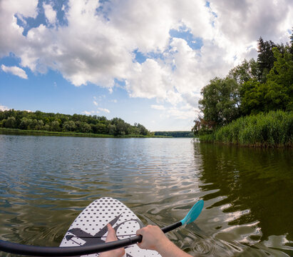 Paddleboarding on a Serene Lake - Powered by Adobe