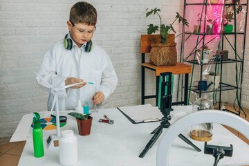 Student conducting science experiment on sustainability in laboratory