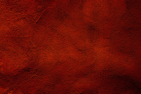 Rich Texture of Deep Red Earth Surface in Close-Up View