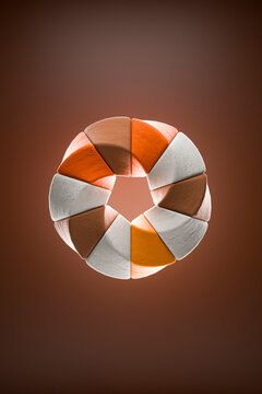 Geometric abstract torus arrangement of 3D pentagon stone shapes