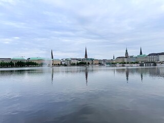 old city centre building reflections on the lake surface, lake in the historical city centre