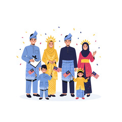 Malaysian family in traditional attire celebrating national day with flags and confetti.