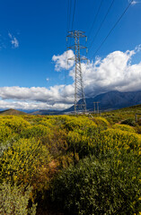 A view over the mountains around Worcester, Western Cape, South Africa, with electrical pylons in the foreground.