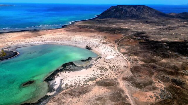 Isla de lobos volcanic landscape meeting turquoise waters