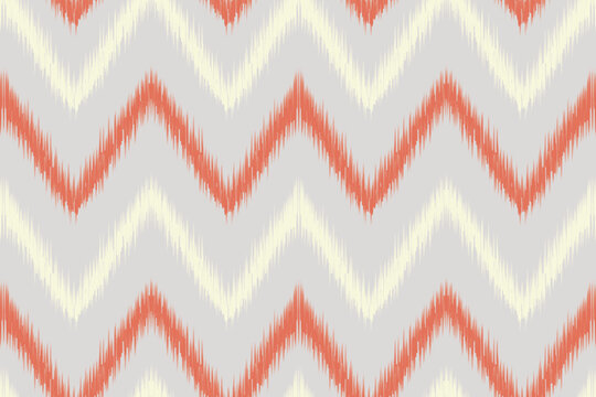 Coral & Cream Ikat Chevron on Gray &ndash; elegant tribal seamless pattern perfect for home decor textiles, wrapping paper, backgrounds, and modern fabric design.
