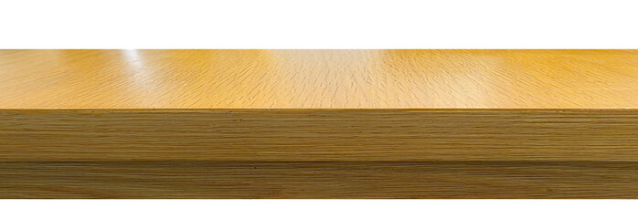 Close-up of a polished wooden table edge with visible grain texture