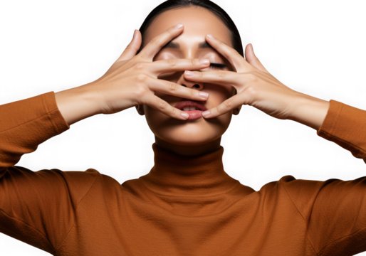 Woman hiding face with hands against dark background