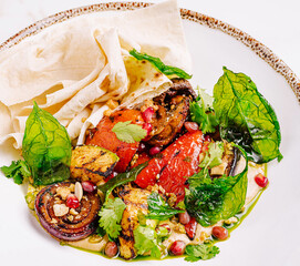 Grilled vegetables with herbs served on a plate for a healthy meal