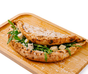 Delicious flatbread filled with fresh greens and cheese on a wooden platter