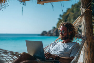 a digital nomad trader working on a laptop on a tropical beach