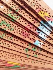 Close-Up of Decorative Wooden Fans With Colorful Painted Patterns and Details
