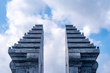 Symmetrical ancient-style gate made of stone, representing cultural heritage and timeless beauty.