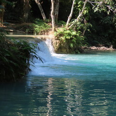 romantic turquoise water, small waterfall in the jungle