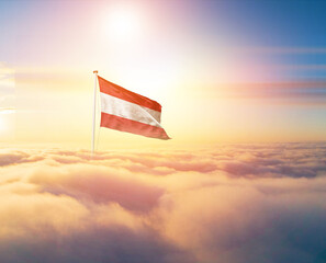 Austria national flag aerial view clouds in beautiful sky. Top view. Drone. Aerial bird's eye fly...