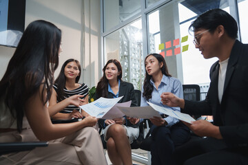Business people working and discussing financial chart together in office meeting