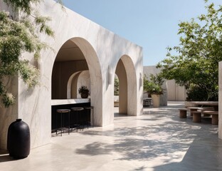 Sun-drenched patio with arched marble walls, minimalist bar, and outdoor seating under a clear sky