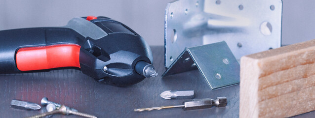 Tools and materials arranged on a workbench for a home improvement project in a workshop environment