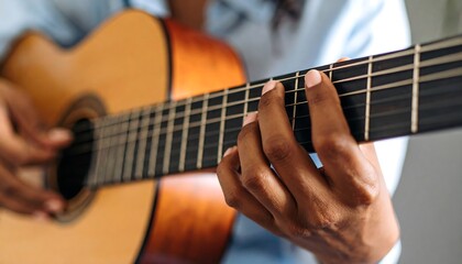 Obraz premium Close-up of hands playing acoustic guitar (1)