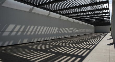 Fototapeta premium Architectural Shadow Play: An outdoor space where sunlight cascades through a modern roof structure, casting captivating shadows on the wall, resulting in an architectural display of light and form.