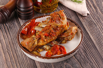 Baked lamb ribs with vegetables