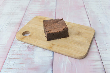 Classic Chocolate Brownie with semisweet chocolate pieces that melt as they bake, creating rivulets...