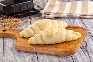 Raw uncooked croissant for bake