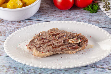 Grilled lamb steak with bone